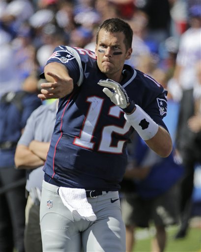 New England Patriots quarterback Tom Brady warms up on the sidelines during the first half of an NFL football game Sunday Sept. 20 2015 in Orchard Park N.Y