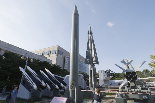 Visitors looks at models of North Korea's Scud-B missile center left and other South Korean missiles on display at the Korea War Memorial Museum in Seoul South Korea Tuesday