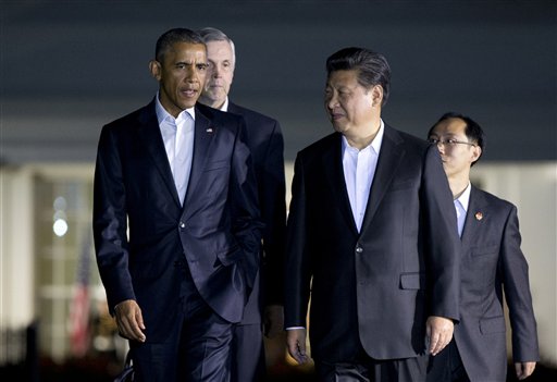 President Barack Obama and Chinese President Xi Jinping right walk from the West Wing of the White House in Washington Thursday Sept. 24 2015 for a private dinner at the Blair House across the street from the White House. Xi arrived in Washington