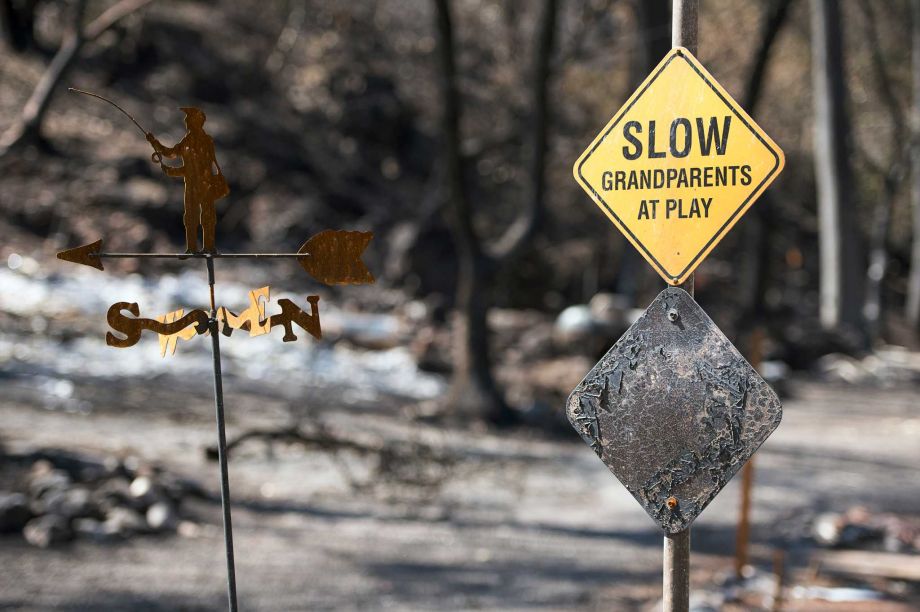 A scorched sign and homes remain on Thursday Sept. 17 2015 in Anderson Springs Calif. The Valley Fire that sped through Middletown and other parts of rural Lake County less than 100 miles north of San Francisco has continued to burn since Saturday