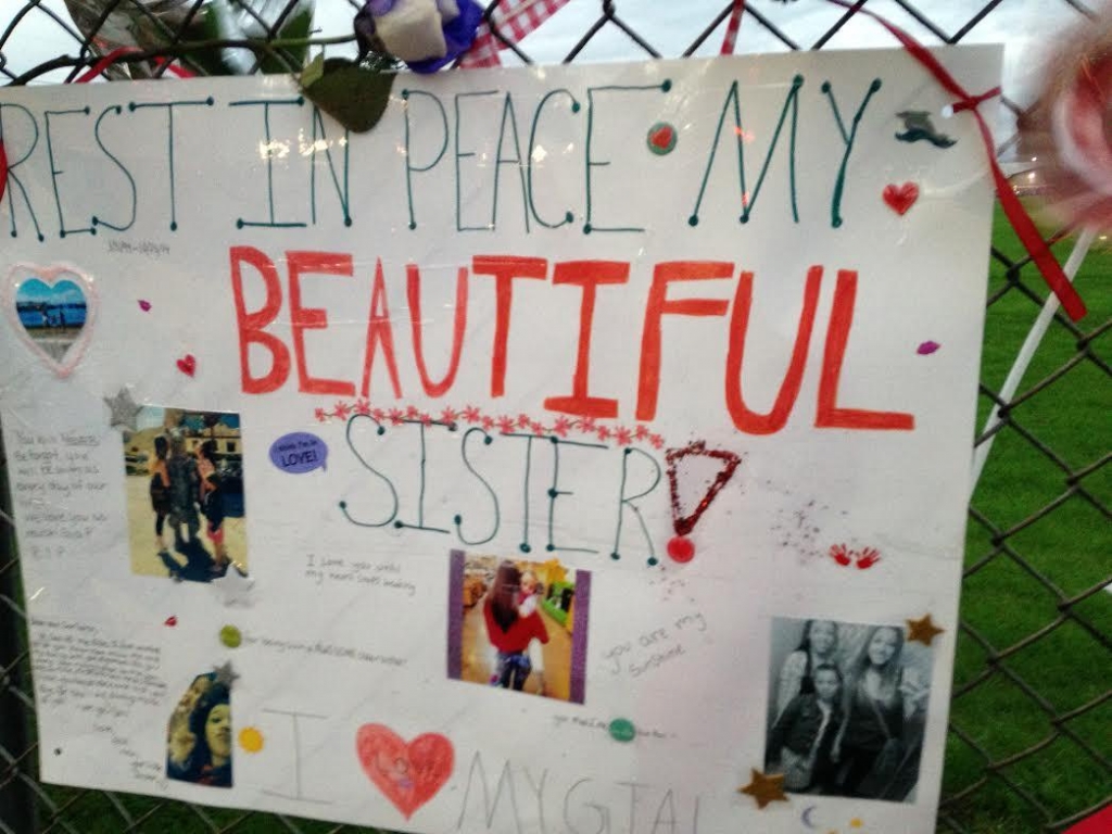 One of signs on memorial fence outside Marysville Pilchuck High School in October 2014