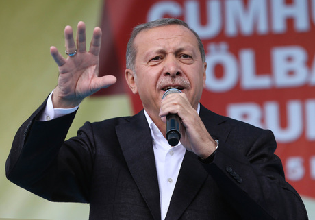 People wave Turkish national flags during an'antiterorrism rally in Istanbul