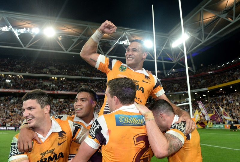 Justin Hodges of the Broncos and team mates celebrate victory after the NRL First Preliminary Final match between the Brisbane Broncos and the Sydney Roosters at Suncorp Stadium in Brisbane