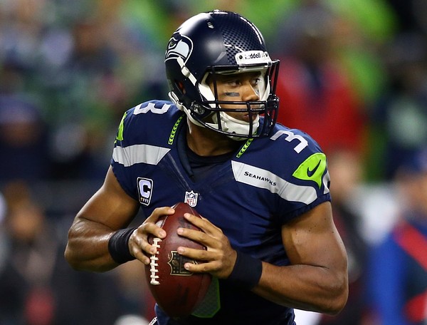 SEATTLE WA- SEPTEMBER 15 Russell Wilson #3 of the Seattle Seahawks looks to throw the ball against the San Francisco 49ers during their game at Qwest Field