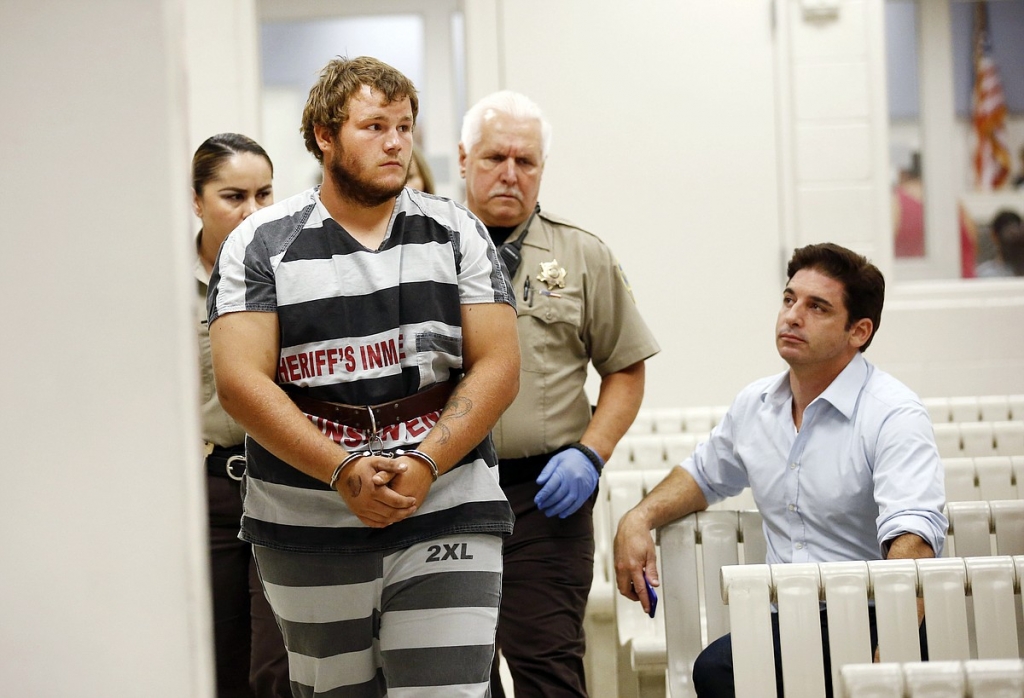 Leslie Allen Merritt Jr. makes his way to appear before a judge at the Maricopa County Sheriff's Office on Saturday Sept. 19 2015 in Phoenix. The landscaper is the suspect in a series of Phoenix freeway shootings and was arrested Friday after tryi