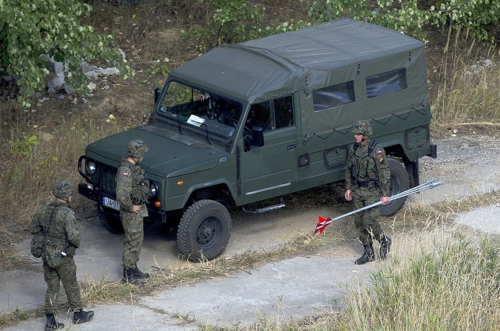 Polish military experts arrive at a spot in in southwestern Poland where a Nazi train missing since World War II could be located in Walbrzych Poland on Monday Sept. 28 2015. Chemical radiation and explosives experts are checking the site to exclude