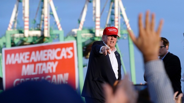 Republican presidential candidate Donald Trump centre greets supporters after speaking at a campaign event aboard the USS Iowa battleship in Los Angeles on Tuesday