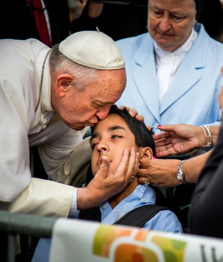 Meeting of Families Pope Francis kisses and blesses Michael Keating 10 of Elverson Pa after arriving in Philadelphia and exiting his car when he saw the boy Saturday Sept. 26 2015 at Philadelphia International Airpo