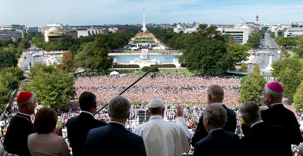 Pope Francis look out onto crowd