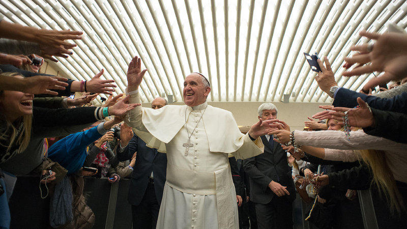 Francis greeting the masses at the Vatican