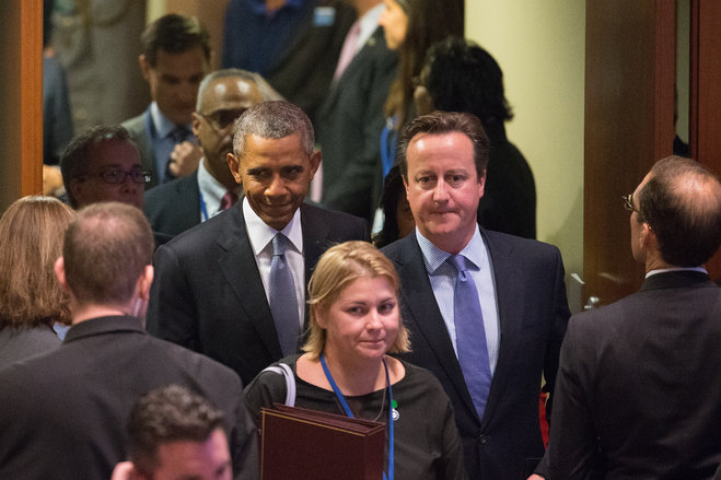 President Barack Obama and British Prime Minister David Cameron right arrive for a United Nations Peacekeeping Summit Monday Sept. 28 2015 at United Nations headquarters. Syrian Ambassador to the United Nations Bashar Jaafar