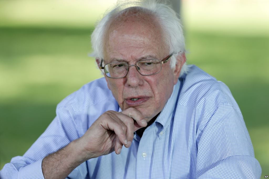 Democratic presidential candidate Sen. Bernie Sanders I-Vt. speaks during a television interview before a town hall meeting Sept. 3 2015 in Grinnell Iowa