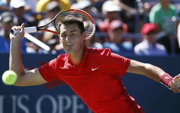 Bernard Tomic of Australia returns a shot to Richard Gasquet of France during the third round of the U.S. Open tennis tournament Saturday Sept. 5 2015 in New York