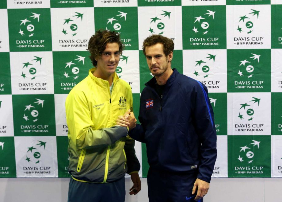 Australia's Thanasi Kokkinakis left and Britain's Andy Murray pose for the media after the draw for the semifinal tennis matches in the Davis Cup in Glasgow Thursday Sept. 17 2015