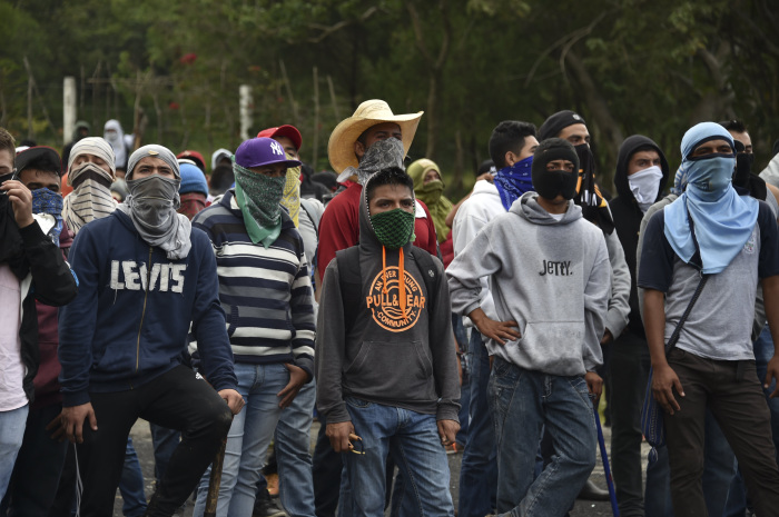 Protesters clash with riot police along the Tixtla Chilpancingo highway in Tixtla Guerrero State Mexico on Sept. 22 2015.
Yuri Cortéz  AFP