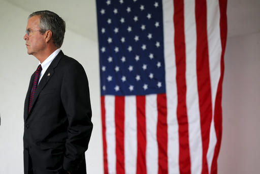 U.S. Republican presidential candidate Jeb Bush waits to take part in ceremonies to remember the victims of the