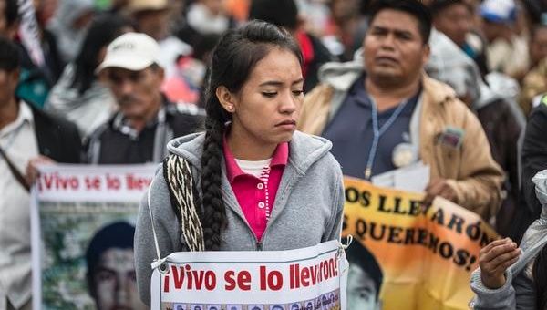 Protesters remember the Ayotzinapa students who disappeared a year ago today