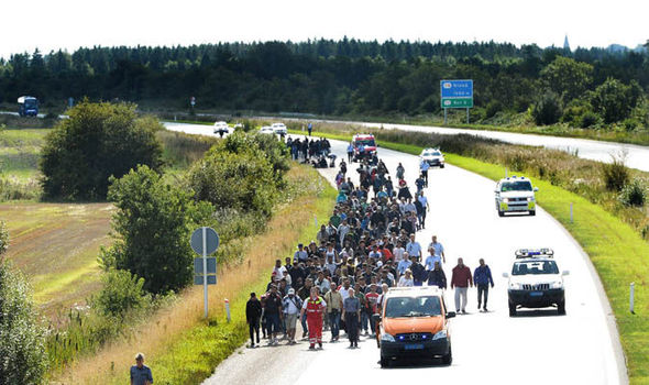 Refugees walking on motorway