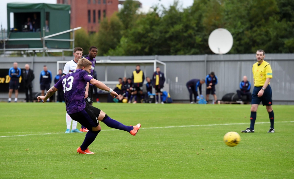 Rangers striker Martyn Waghorn slots home his side's second goal of the game from the penalty spot against Dumbarton