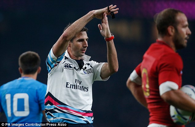 Referee Craig Joubert calls time out for the TMO during France's win over Italy