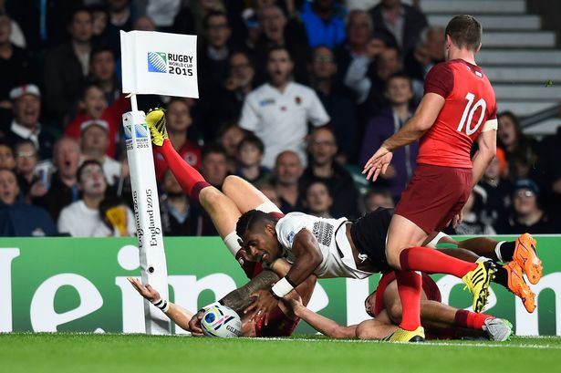 Fiji's Nikola Matawalu scores a try which is later disallowed