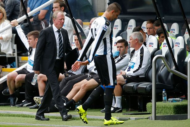 Aleksandar Mitrovic looks dejected as he walks past manager Steve Mc Claren after being sent off