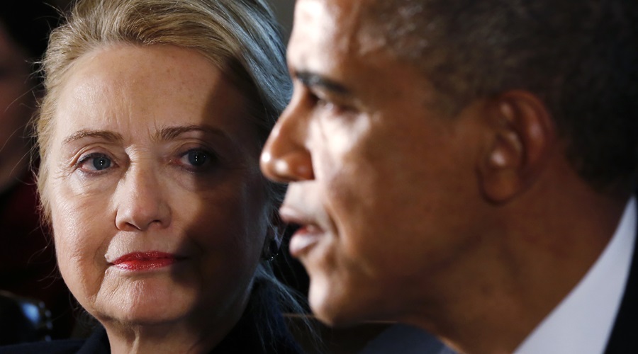 ReutersFormer Secretary of State Hillary Clinton looks at President Barack Obama during a White House function