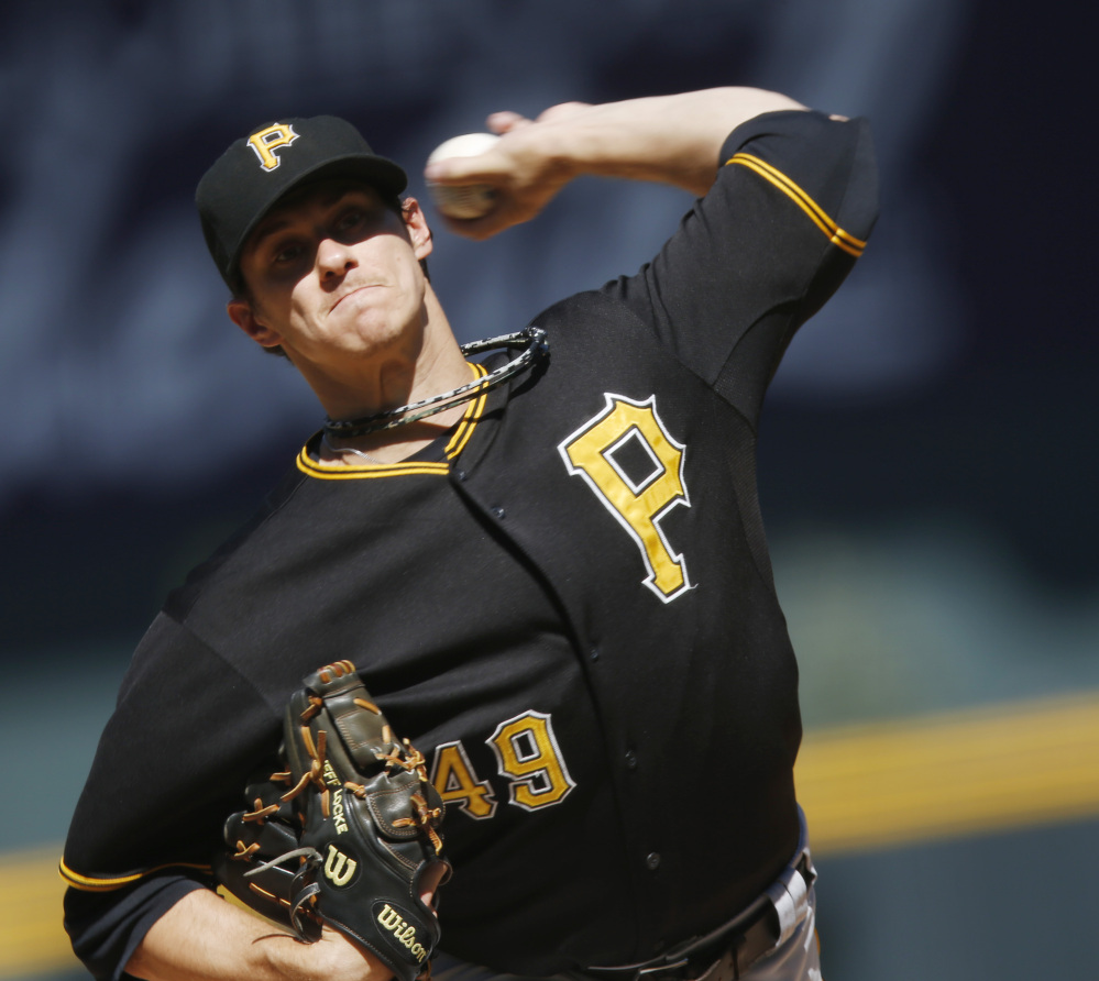 Jeff Locke of the Pirates delivers a pitch in Thursday’s 5-4 win over the Colorado Rockies in Denver – Pittsburgh’s 10,000th career victory