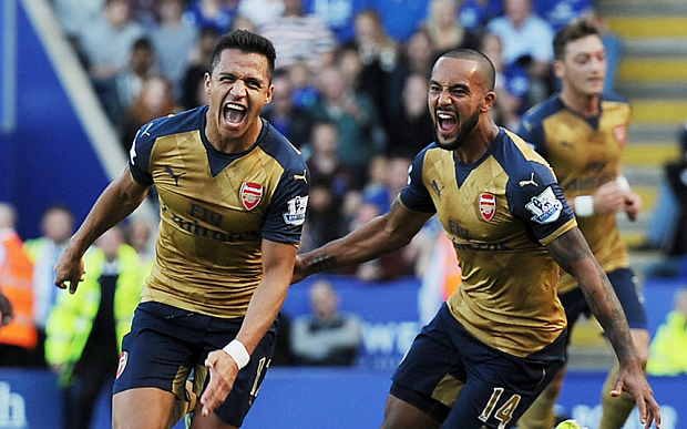 Sanchez left celebrates scoring Arsenal's second with Walcott