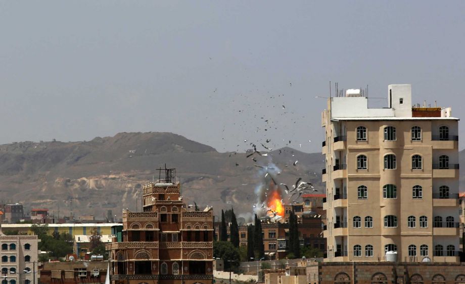 Debris and smoke rise after a Saudi-led airstrike hits an army base in Sanaa Yemen Monday Sept. 14 2015. Saudi Arabia is leading a coalition of mainly Gulf nations fighting Shiite Yemeni rebels known as the Houthis who are allied with army units loya