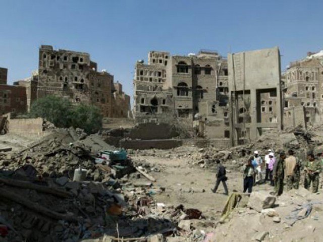 Yemenis inspect the rubble of UNESCO-listed buildings that were destroyed by air strikes carried out by the Saudi-led coalition in the Al Falihi neighbourhood in Sanaa's old city