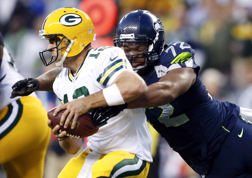 Seattle Seahawks defensive end Michael Bennett forces a fumble by Green Bay Packers quarterback Aaron Rodgers. Joe Nicholson-USA TODAY Sports