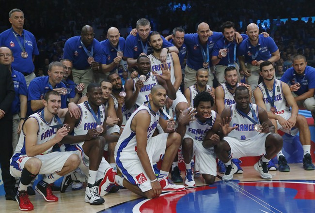 France's basketball team pose with their bronze medals after wining the 3rd place final during the Euro Basket European Basketball Championship bronze medal match between France and Serbia at Pierre Mauroy stadium in Lille northern France Sunday Sept