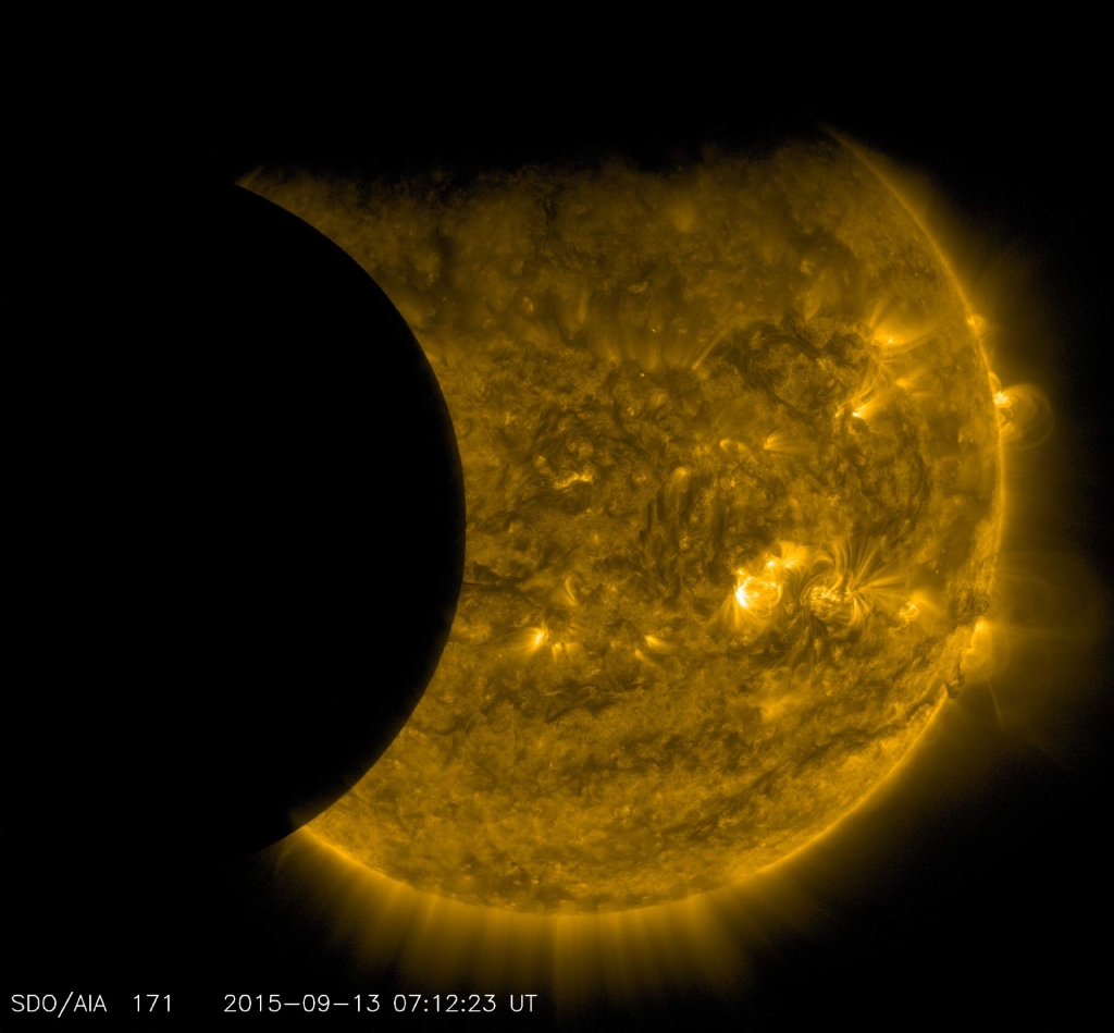 The edge of Earth visible near the top of the frame appears fuzzy because Earth’s atmosphere blocks different amounts of light at different altitudes