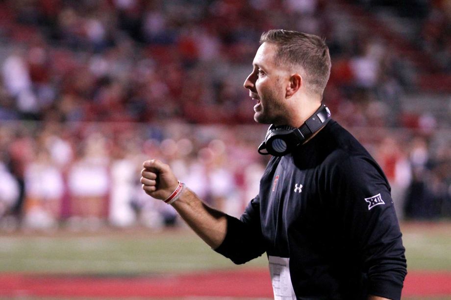 Texas Tech head coach Kliff Kingsbury holds congratulates his players during the second half of an NCAA college football game against Arkansas Saturday Sept. 19 2015 in Fayetteville Ark. Texas Tech beat Arkansas 35-24