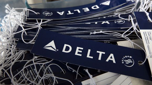 Delta Air Lines luggage tags in a basket at a skycap kiosk at San Francisco International Airport on Jan. 12 2010