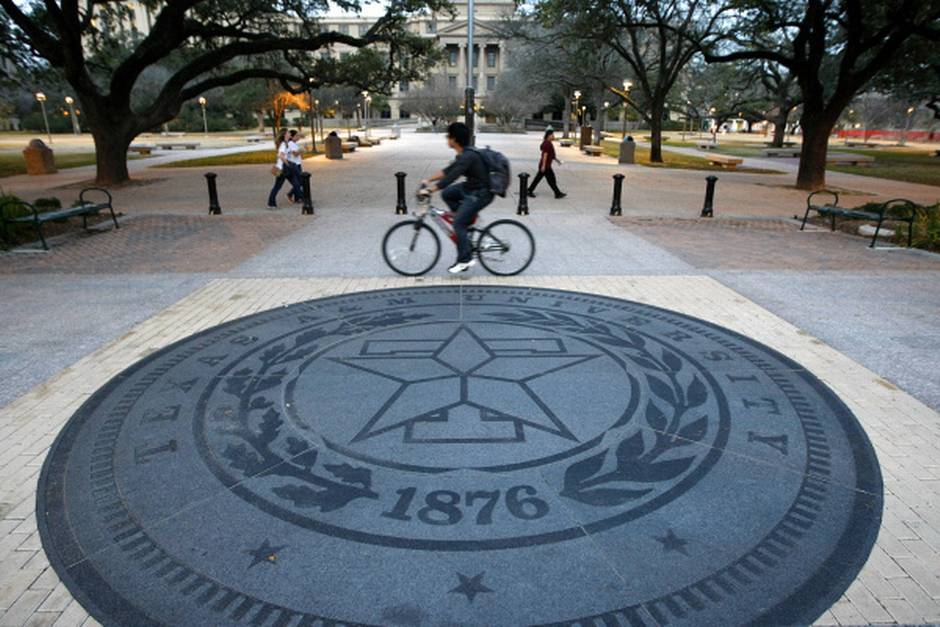 Texas A&M students traverse Military Walk on the Texas A&M University campus in College Station. File 2011/Staff