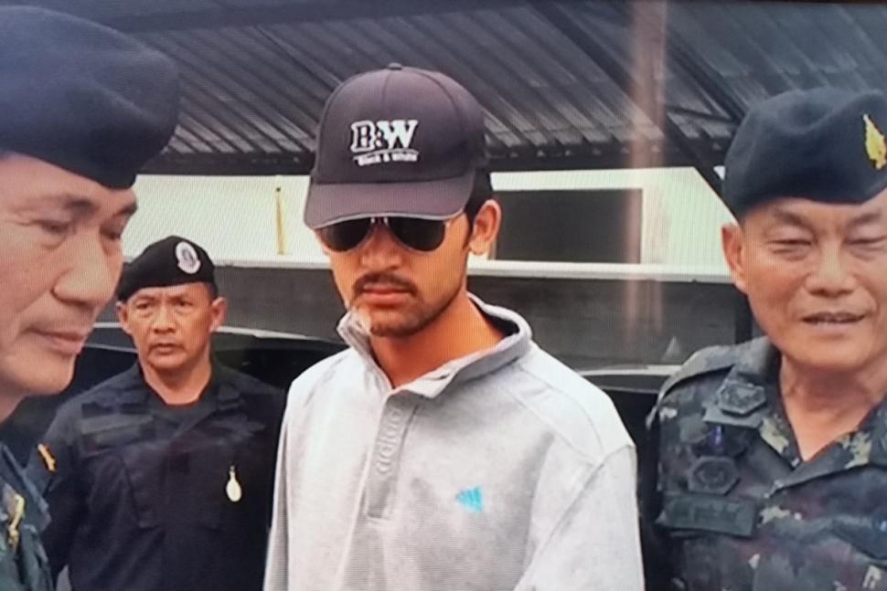 Thai policemen escorting Bangkok blast suspect in Thailand