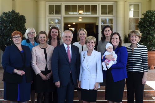 The PM poses with female members of the government