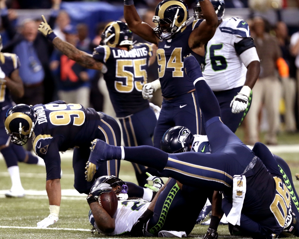 The Rams celebrate after stuffing Marshawn Lynch on the final play of the