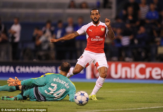 Theo Walcott slots home a superb consolation but it wasn't enough for Arsenal