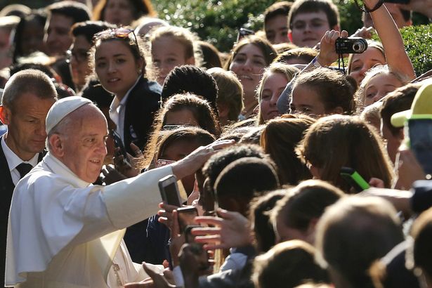 Pope Francis greets schoolchildren