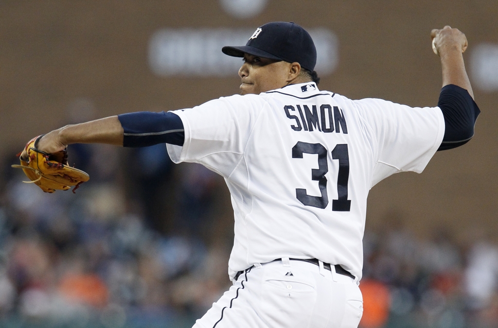 DETROIT MI- SEPTEMBER 26 Pitcher Alfredo Simon #31 of the Detroit Tigers delivers against the Minnesota Twins during the first inning at Comerica Park