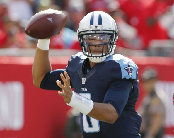 Tennessee Titans quarterback Marcus Mariota looks to pass during the first half of an NFL football game against the Tampa Bay Buccaneers in Tampa Fla. Mariota’s electric debut against NFL draft classma