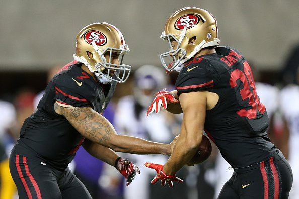 Colin Kaepernick #7 of the San Francisco 49ers Jarryd Hayne #38