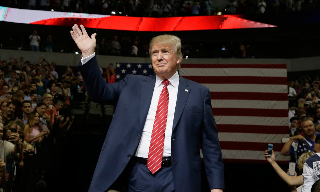 Republican presidential candidate Donald Trump waves to supporters as he takes the stage for a campaign event in Dallas Monday Sept. 14 2015