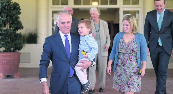 Australian prime minister Malcolm Turnbull left holds his grandson Jack Turnbull Brown as his family gathers for