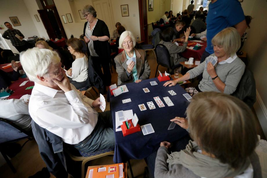 Competitors play bridge at the Acol Bridge Club in West Hampstead London Tuesday Sept. 22 2015. A British judge has been asked to resolve the question of whether bridge is a sport after Sport England ruled that the popular card game is not. The decisio