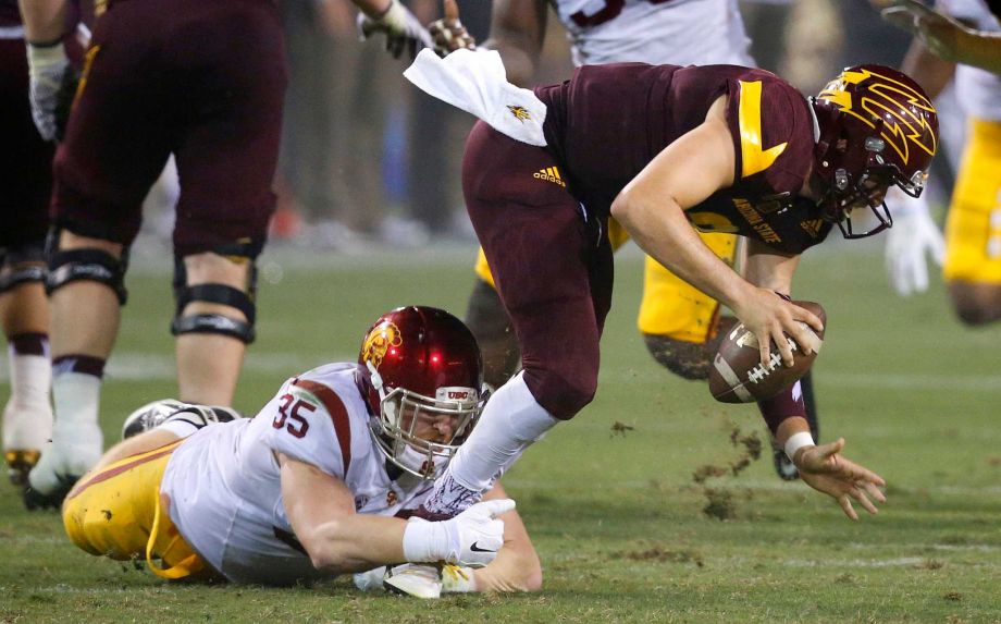 Southern California's Cameron Smith sacks Arizona State's Mike Bercovici right during the second half of an NCAA college football game Saturday Sept. 26 2015 in Tempe Ariz. Southern California defeated Arizona State 42-14