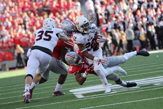 Junior safety Vonn Bell attempts to tackle an Northern Illinois player during a game on Sept. 19. OSU won 20-13. Credit Samantha Hollingshead